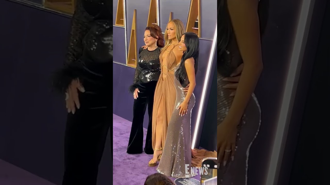 Jennifer Lopez, Gloria Estefan, and Becky G pose on the AmericanMusicAwards carpet.