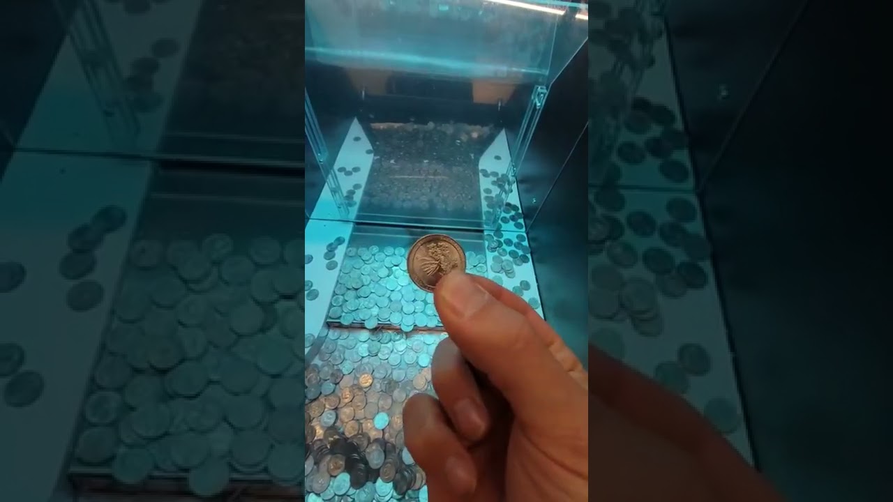 Wad of Money Locked in a Coin Pusher #shorts